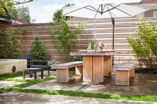 Since Portland is at roughly the same latitude as Sapporo, Japan, Howells was inspired by minimalist Japanese gardens. All of the wood used in the space, including the furniture, is designed to weather to a silver-gray shade over time.