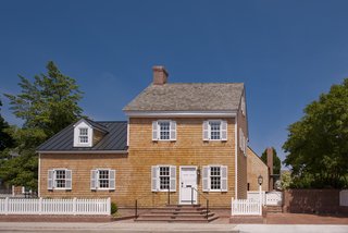 "The existing house was an important house in the heart of the historical district," architect Robert Gurney said. To honor the property’s legacy, and fulfill the city’s requirements, the firm fully restored the exterior with cedar shingles.