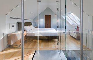This custom glass structure by Ilex Construction allows for an abundance of light during the day. At night, Lightolier fixtures on the ceiling illuminate the Ella bed. Sherwin-Williams "Pure White" was painted on all interior walls.