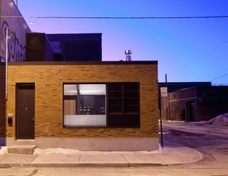 Chabauty chose a black door on the outside of the structure to maintain the original, unassuming exterior. It can still throw off guests who aren't sure what to expect when they walk inside. "People still think it's a business or an office," he says. "They're always surprised."