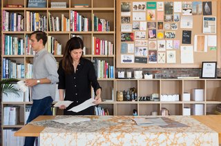 "We draw inspiration from artists like James Turrell or Donald Judd, who understand color and form in an advanced way. Or even Raf Simons. We're definitely pulling inspiration from various mediums," Calico co-founder Nick Cope says. Nick and Rachel review materials in their Brooklyn-based studio.