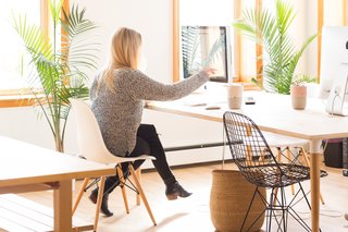 A Calico team member is shown working in the company's Brooklyn-based creative studio.