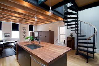 A Chicago Renovation Taps Into its Attic to Almost Double its Square Footage - Photo 2 of 8 - Wherever possible, Shively looked to work with local craftsmen. For example, all of the cabinetry was made by Lambright Woodworking, an Amish company in Indiana, and custom doors and trim were made by Jarzab Construction, a team of local Polish carpenters.
