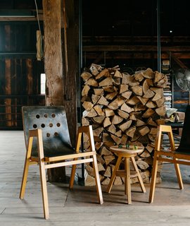 A Passive House and "Sauna Tower" Join a 19th-Century Barn in the Hudson Valley - Photo 8 of 13 - Vintage bent plywood stacking chairs by Roland Rainer are purposeful and can be moved to suit any situation.