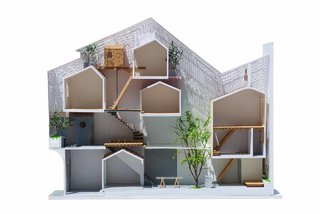 A Narrow Courtyard Joins a Unique Two-Family Home in Saigon - Photo 2 of 10 -