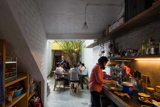 A Narrow Courtyard Joins a Unique Two-Family Home in Saigon - Photo 6 of 10 -
