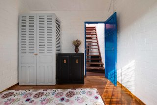A Narrow Courtyard Joins a Unique Two-Family Home in Saigon - Photo 10 of 10 -