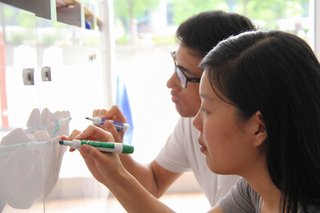 BetaBox: A Mobile Prototyping Lab in a Shipping Container - Photo 2 of 4 - Students at work in the BetaBox on the Duke University campus in 2014.