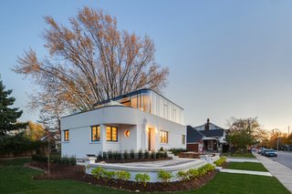 15 Modern Additions to Traditional Homes - Photo 8 of 15 - The home's white stucco exterior is actually a thin layer of stucco spread over a modern EIFS (Exterior Insulation and Finishing System) from Dryvit.