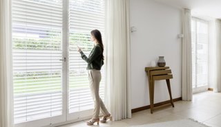 According to the U.S. Consumer Product Safety Commission, dangling cords from blinds are one of the top dangers for babies and toddlers. To remove the risk of cord-related accidents, invest in cordless blinds, such as these from Hunter Douglas. Thanks to PowerView Motorization technology, you can control light penetration with a smart, battery-operated wand control system, and can keep your nursery well shaded in the heat of the day.