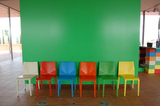 The bright-green hue of this wall, seen just inside the entrance, was used as a complementary color throughout the property.