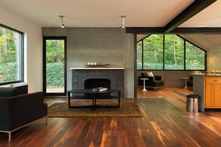 Industrial finishes include Viroc cement fiber panels over the fireplace. 