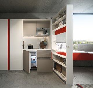 Clei's Kitchen Box looks like a cabinet when closed, but it swings open to reveal a full kitchenette, with a cooktop, sink, refrigerator, dishwasher, and microwave.