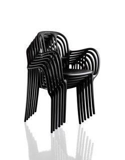 Stash a stack of Milà chairs in the hall closet for extra seating. Jaime Hayon's design for Magis, made of plastic, achieves its sculptural form through gas-injection molding.