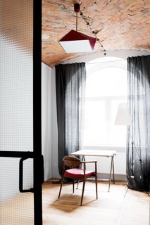 All This Warehouse Stores Nowadays Is Impeccably Cool Furniture - Photo 3 of 4 - In most of the loft, the original wood flooring and the herringbone-patterned, vaulted brick ceiling have been carefully preserved. 