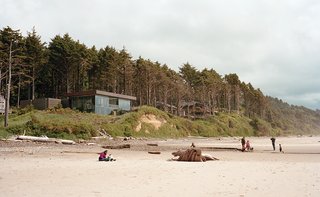 10 Modern Glass Homes - Photo 3 of 10 - Boora Architects designed a house for Ryan and Mary Finley near Cannon Beach, Oregon, that resembles a glass prism and rises above a shallow cliff overlooking the Pacific Ocean. The 3,330-square-foot structure is topped with a green roof.