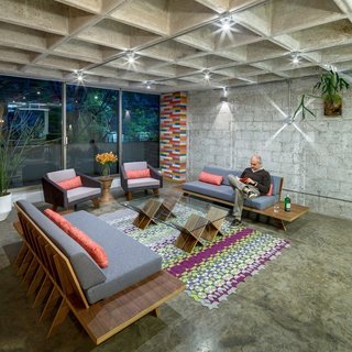 Arqmov Workshop began their renovation by stripping the apartment down to the basics. Removing finishes revealed a polished concrete floor and waffle-slab ceiling.