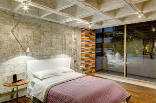 Each of the private zones enjoys its own outdoor space. The master bedroom has access to a balcony that runs along the front of the apartment. 