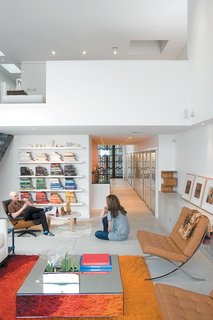 This is How You Combine Modern Architecture, Flea Market Finds, and Art All Together - Photo 3 of 8 - Since Dwell last visited the couple, they now have a daughter and one chair in particular is in constant competition. "It sounds like a cliché, but a day doesn't go by where everyone sits in the Eames chair. It really is part of our daily routine. We sometimes fight over it." Hernandez says.