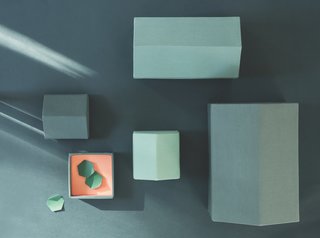 Note Design Studio's Modern Houses and Traditional Houses are architectural boxes that are constructed of cotton shells and paper lining. They're available in a range of hues and come in sets of three or four. 