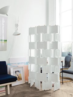 The Brick screen by Eileen Gray for Aram Designs blocks off a small office from the dining room.