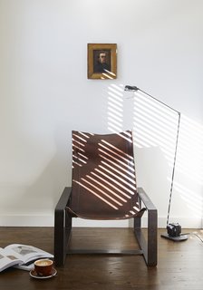In addition to the uniform beds, sconces, writing desks, and chairs found in each room, you’ll find unique antiques like this Tomasso Cimini floor lamp and chair by Jean-Pierre Nicolini.