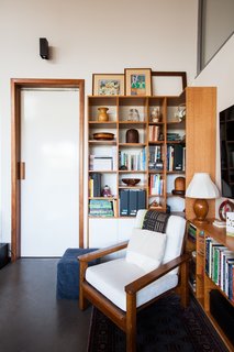 White walls prove a crisp backdrop for details in wood and concrete. 