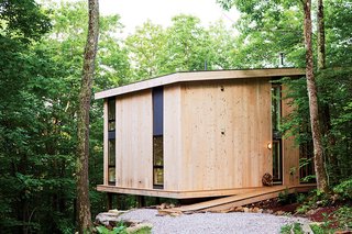 A Little Cabin Reaches Such Great Heights - Photo 3 of 4 - Those costs were partially recouped by using knotted pine planks for the exterior. 