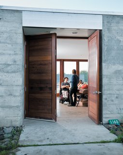 The wide front door opens onto a wide central living space where the entire family—and a regular cast of visitors—spends much of their time. 