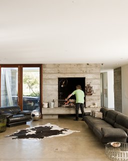 The oversize hearth (of which there is an outdoor double) was part of the original design specifications. "Ben said he wanted a fireplace big enough to cook a wild boar," says Mark Anderson of Anderson and Anderson. 