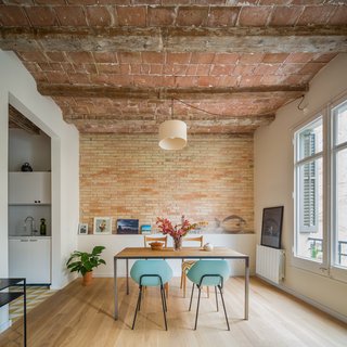 Nook Architects renovated an apartment in a 1931 building in Barcelona's Eixample district for a young woman who travels often for business. 