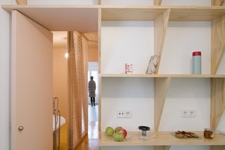 What was once a dark apartment is now a bright home filled with candy colors.