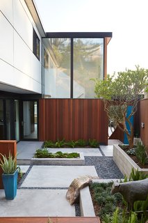 Not the Eichler Post-and-Beam Style You Know - Photo 6 of 7 - Outer Space Landscape Architects refreshed the courtyard with new hardscaping.