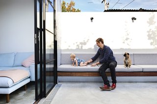 It Looks Like a Playland but This Home Works Hard - Photo 2 of 10 - The concrete courtyard offers the family, who four months ago welcomed a daughter, the option to extend their living space outdoors. 