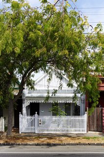 It Looks Like a Playland but This Home Works Hard - Photo 10 of 10 - The unedited street-facing facade masks the home's rejuvenation and preserves the architectural continuity with its neighbors. 