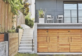 Pricier materials, like the locally sourced cedar used for the garage doors, are applied judiciously. 