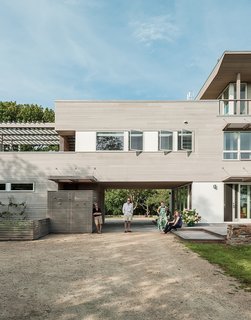 Resolution: 4 Architecture designed a Fishers Island home with warm cedar siding and white windows as a nod to the regional New England vernacular. 