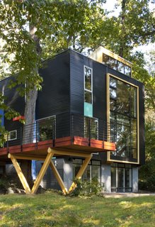 A facade of contrasting colors and textures announces the expansion of this home in Takoma Park, Maryland. Resident and builder Alan Kanner called on longtime collaborator, architect Mark McInturff, to help him add a second story and 900 square feet to the residence. 