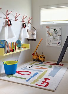 How a Smart Interior Design Saved This House - Photo 7 of 9 - he boys’ playroom is outfitted with a Uten.Silo wall organizer by Dorothee Becker for Vitra and a pair of May Day lamps by Konstantin Grcic for Flos that dangle from a set of Peace hooks by Louise Hederström for Maze.