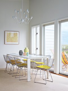How a Smart Interior Design Saved This House - Photo 6 of 9 - A Single Octopus chandelier by Autoban hangs above a Four dining table by Ferruccio Laviani for Kartell and a set of side chairs by Harry Bertoia for Knoll.