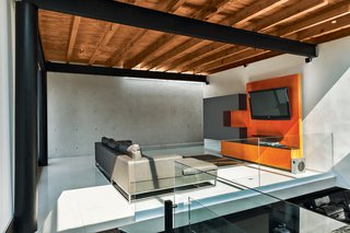 Two Brothers Bring Their Families Together to Share a Scenic Getaway - Photo 3 of 6 - Roche Bobois’s Agami sofa anchors the media room. 