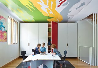 These Modern Parents Show How Invaluable Technology Can Be - Photo 2 of 12 - Along with their dogs Coltrane and Blue, the residence is home to their three children—Rock, eight; Cash, six; and Clover, three. As an example of how the Huffts built the home to be malleable over the years, they designed the playroom in a way that can be modified as they grow up. Matthew explains, "The intention is that their playroom will become their study room. Closets that now hold toys will eventually hold their books." 