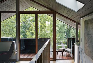 These Modern Parents Show How Invaluable Technology Can Be - Photo 10 of 12 - For the deck that overlooks the backyard, they installed LED Outdoor Floodlights. Shown here is their third-floor office that looks out to these outdoor spaces. 