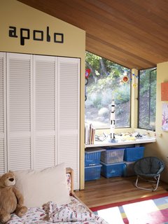Apolo's bedroom is unmistakably that of a young boy, as the old-school computer font and clear debt to NASA suggest. 