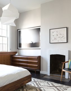 The chair, by Danish designer Arne Hovmand-Olsen, was purchased through Wright. The dresser was sourced from Chairish.