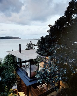 Three Glass-and-Copper Pavilions Conquer the Cliffs - Photo 1 of 10 - The three structures that make up the James-Robertson residence are framed in black-coated aluminum and steel. 