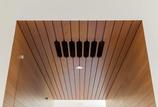 Addional lighting options in the kitchen include diffuse Bartco fluorescent strips hidden in coves overhead.