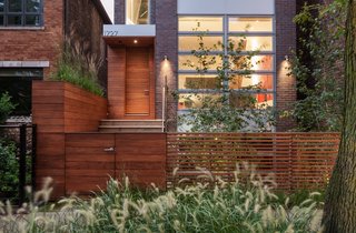 Thanks in part to landscape architect James C. Differding, the residents can enjoy the outdoors on all four levels, from the pocket garden that buffers the house from the street to the rooftop enclave. 