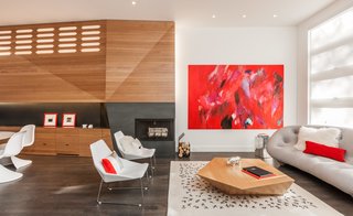 The architects designed around another component of their 345 table in the refurnished living room, adding a Ploum sofa and a pair of Elsa armchairs from Ligne Roset.