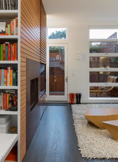 Parts of a modular 345 coffee table, designed by Min | Day’s furniture company, MOD, are dispersed throughout the house, including two pieces in the family room. The rug is from Design Within Reach. 